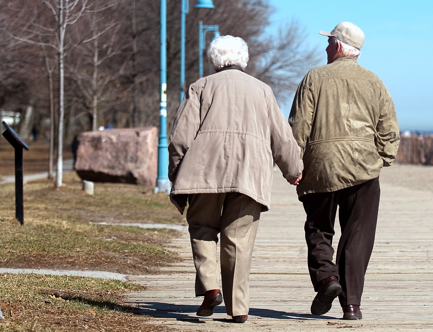 seniors walking holding hands