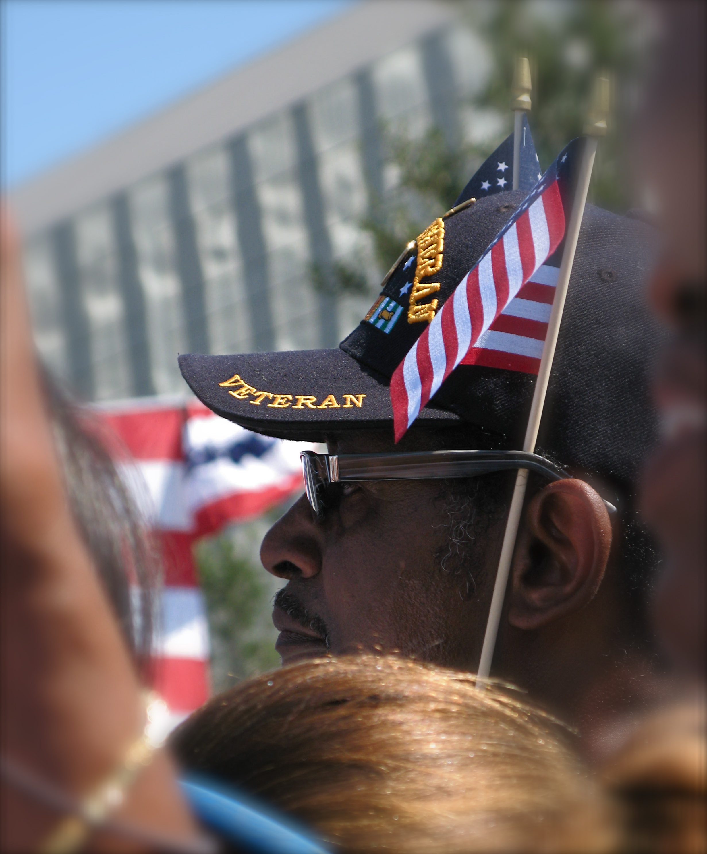 veteran in cap with flag